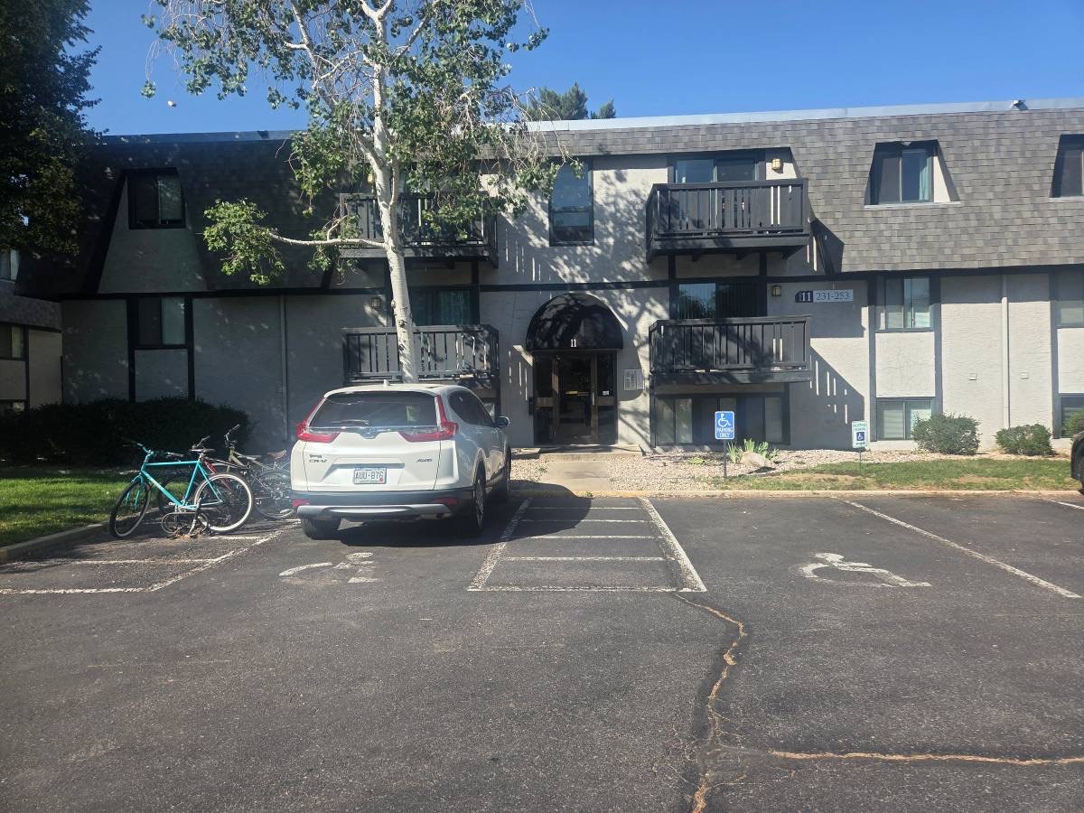 Aspenleaf Apartments building exterior with balconies and parking